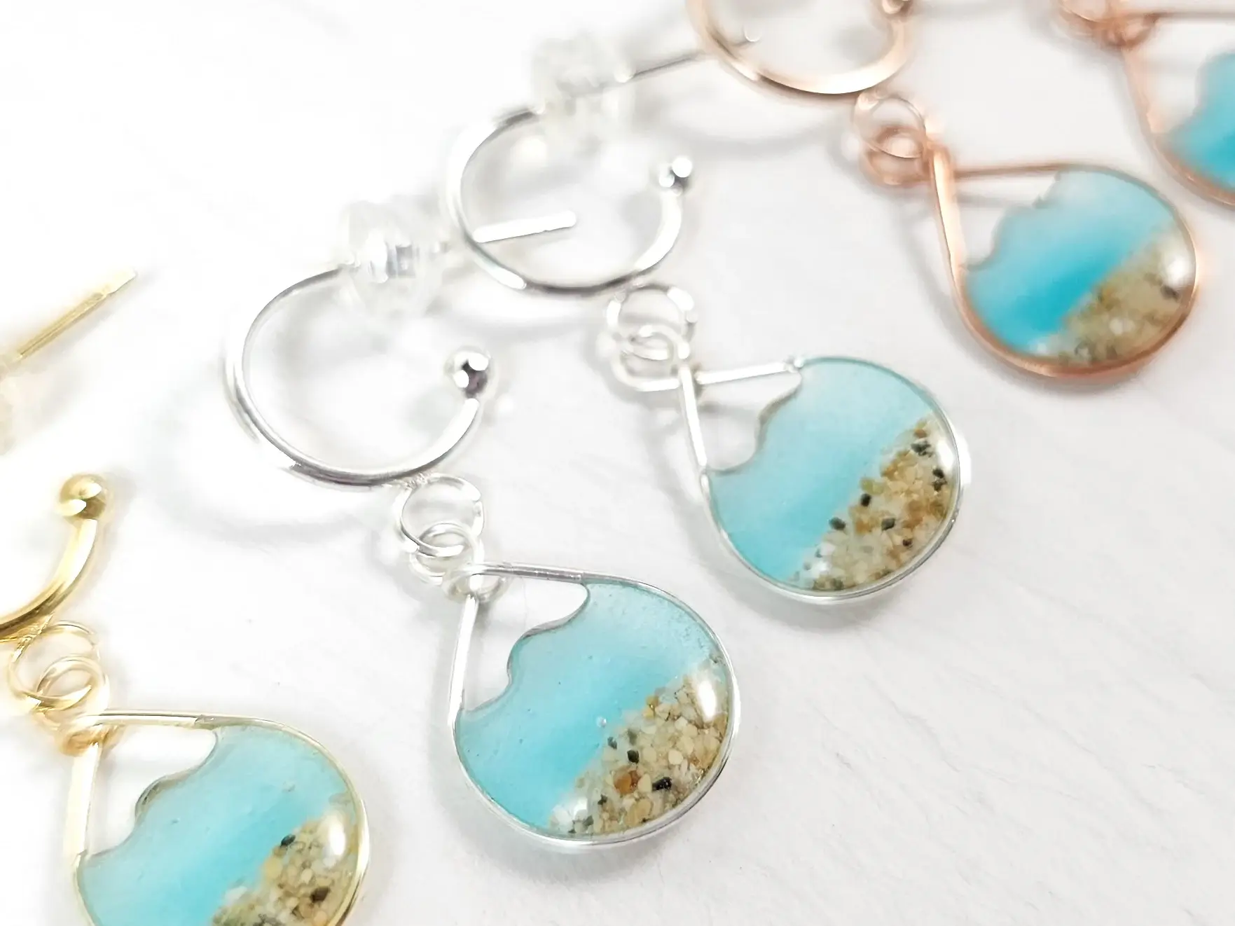 Aqua glow in the dark water sand mini hoop earrings - Image 3