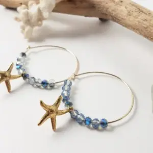Blue crystal and starfish on hoop earrings