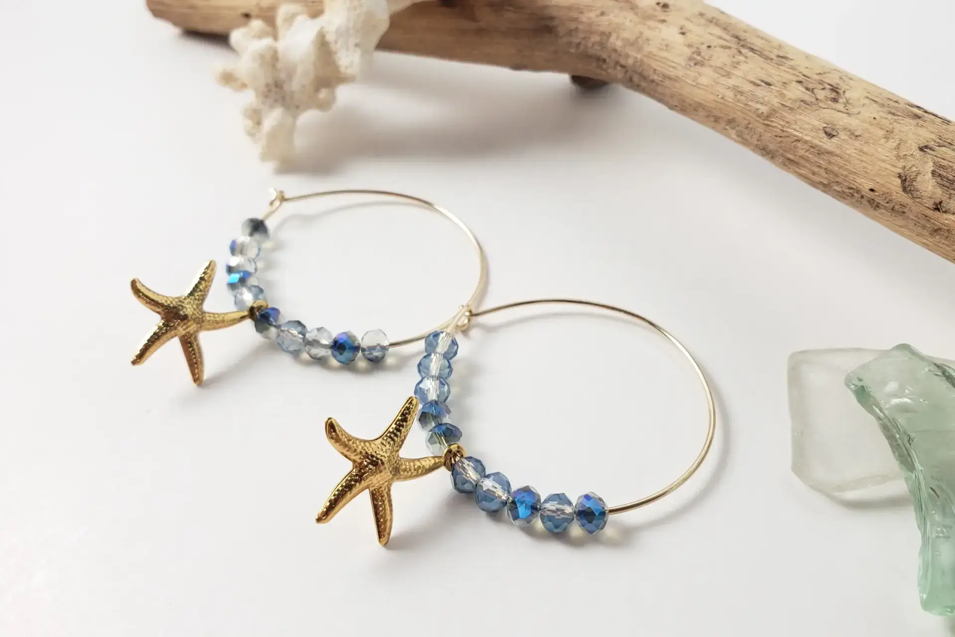 Blue crystal and starfish on hoop earrings