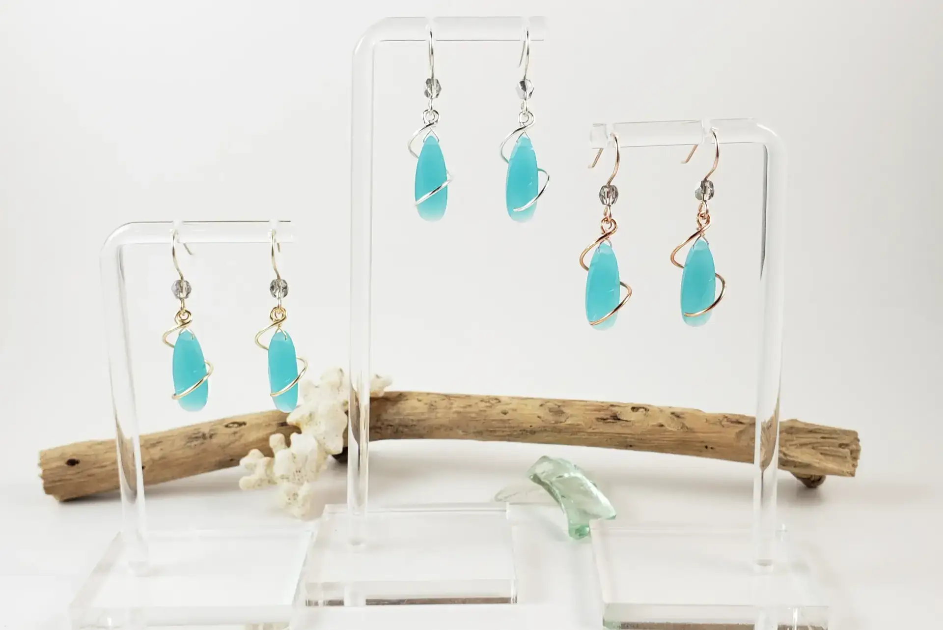Milky blue crystal spiral earrings in yellow gold, silver, or rose gold