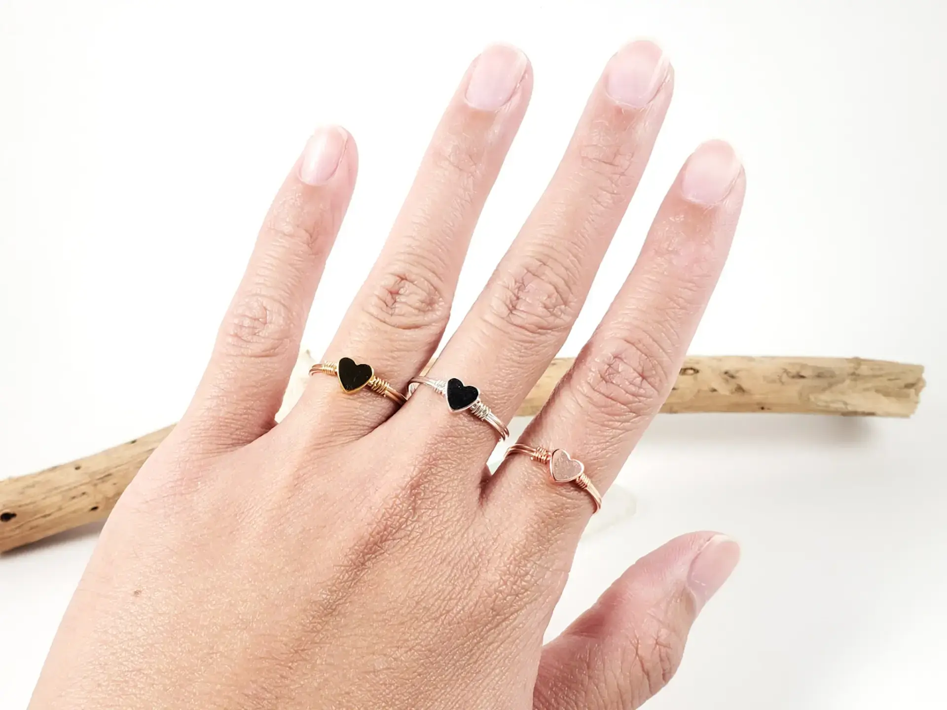 Stacking heart rings in yellow gold, silver, and rose gold - Image 7