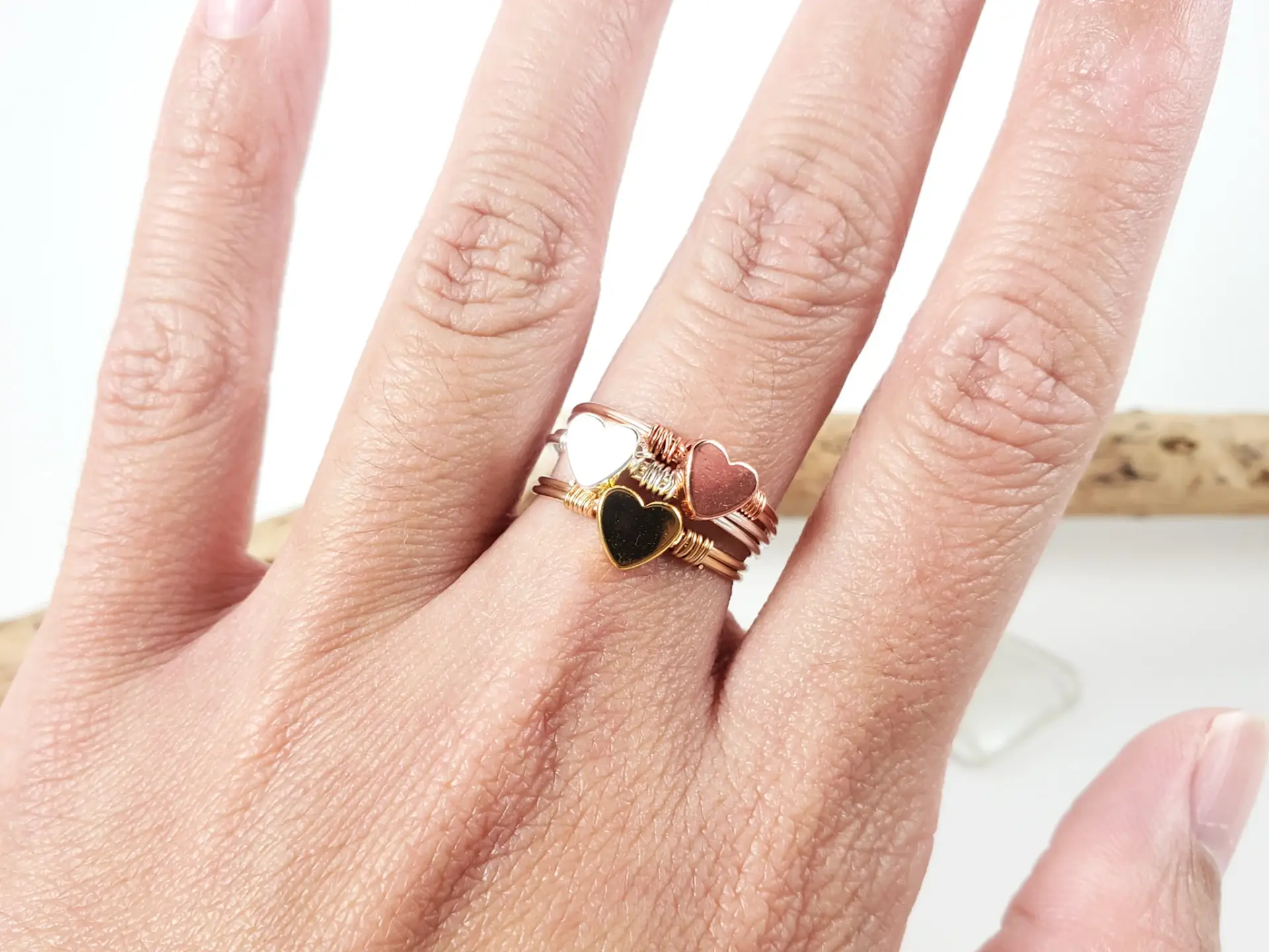 Stacking heart rings in yellow gold, silver, and rose gold - Image 8