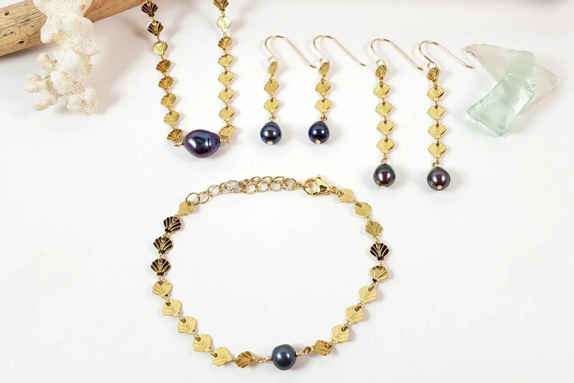Shell chain and freshwater pearl earrings, necklace, and bracelet