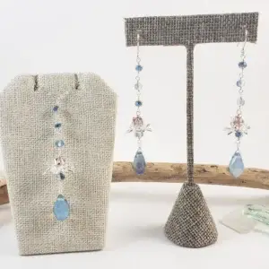 Silver lotus and blue crystal earrings and necklace