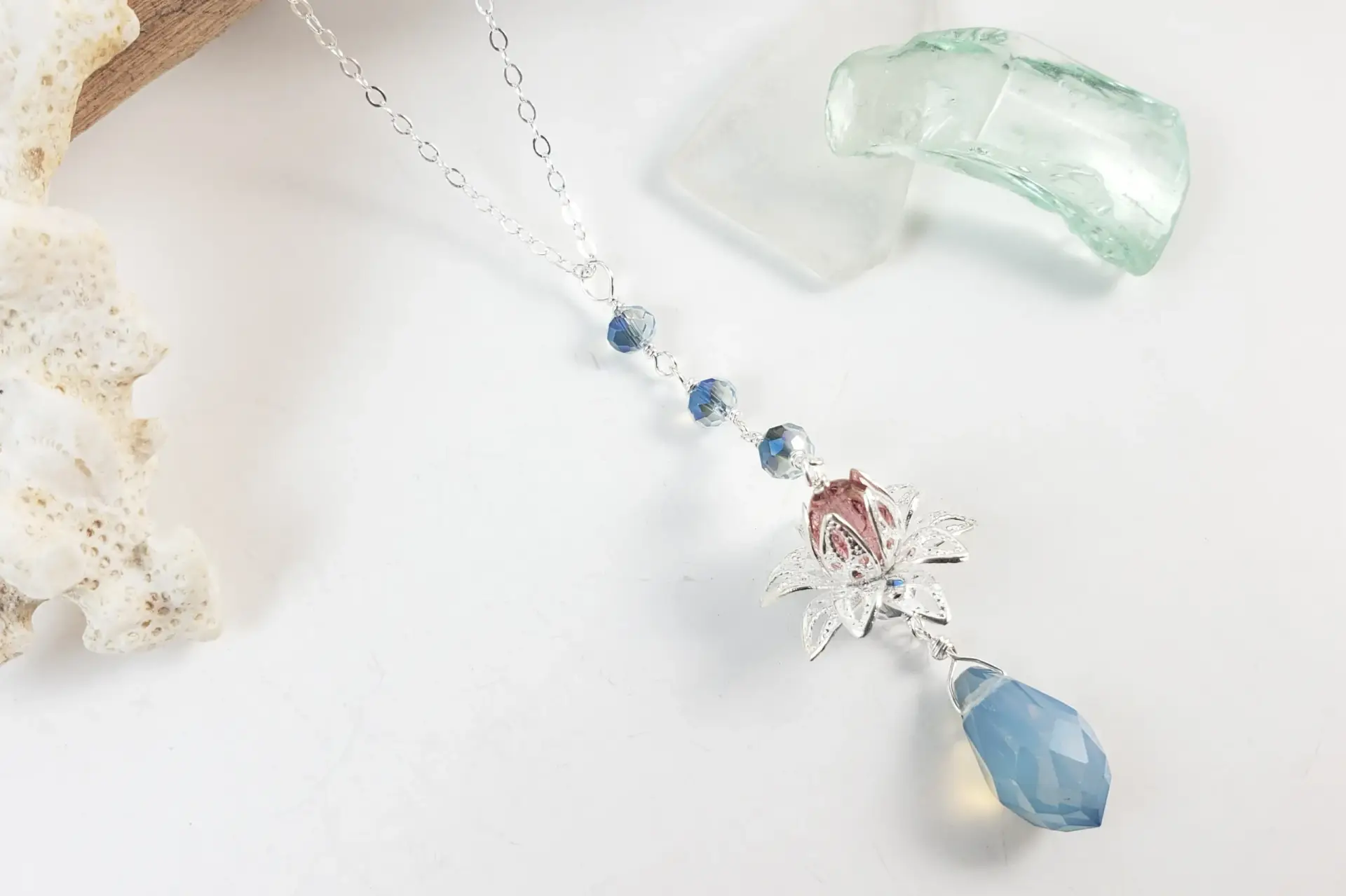 Silver lotus and blue crystal earrings and necklace - Image 3