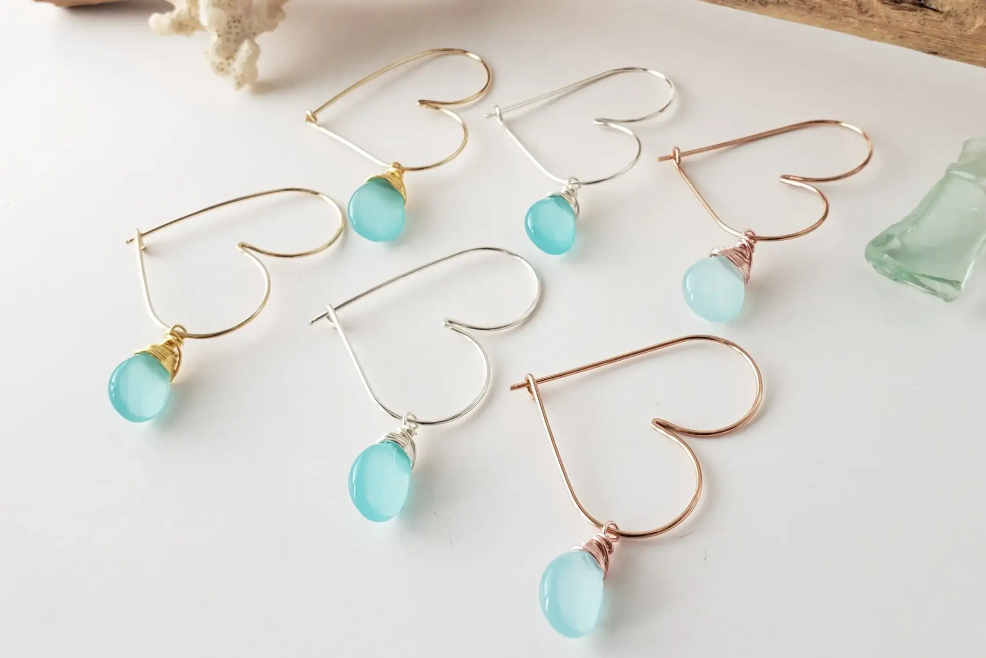 Small heart hoop earrings with blue glass drop
